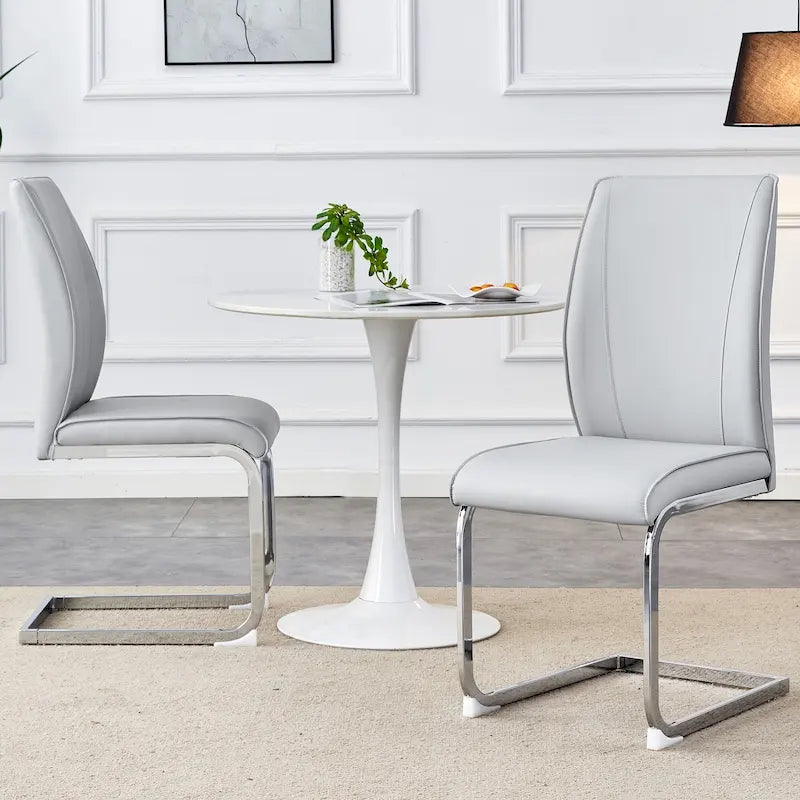 Chaise de salle à manger moderne capitonnée, dossier arqué en cuir PU, pieds cantilever chromés gris
