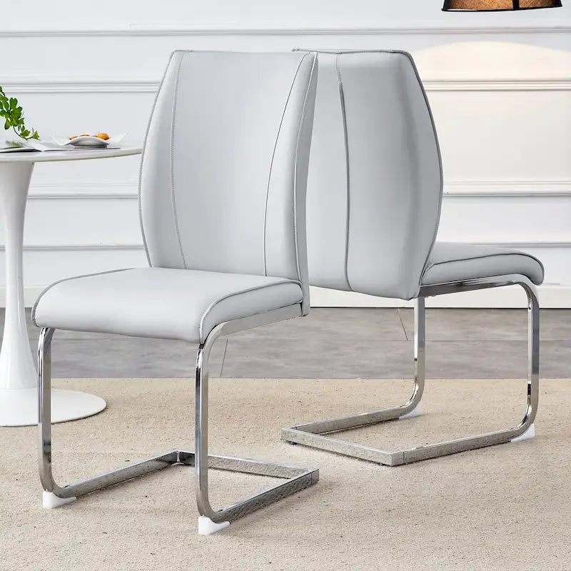 Chaise de salle à manger moderne capitonnée, dossier arqué en cuir PU, pieds cantilever chromés gris