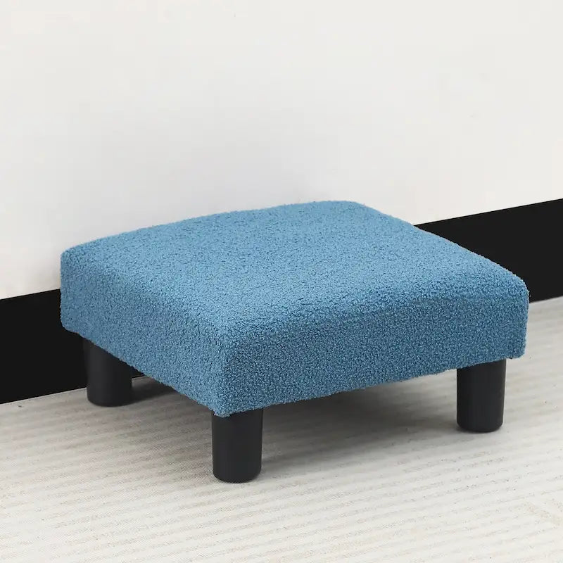 Petit pouf rembourré carré avec pieds noirs en tissu gris